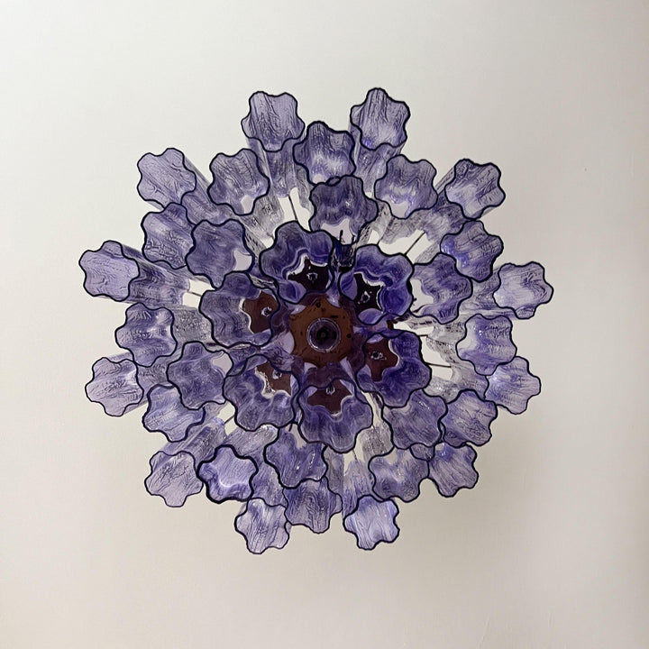 Top view of Murano Star Tube Chandelier with purple star-shaped glass elements on white background