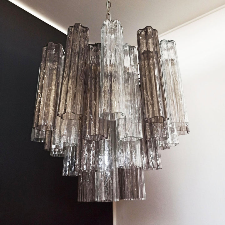 Murano Star Tube Chandelier with smoke gray glass tubes in a dark room corner view