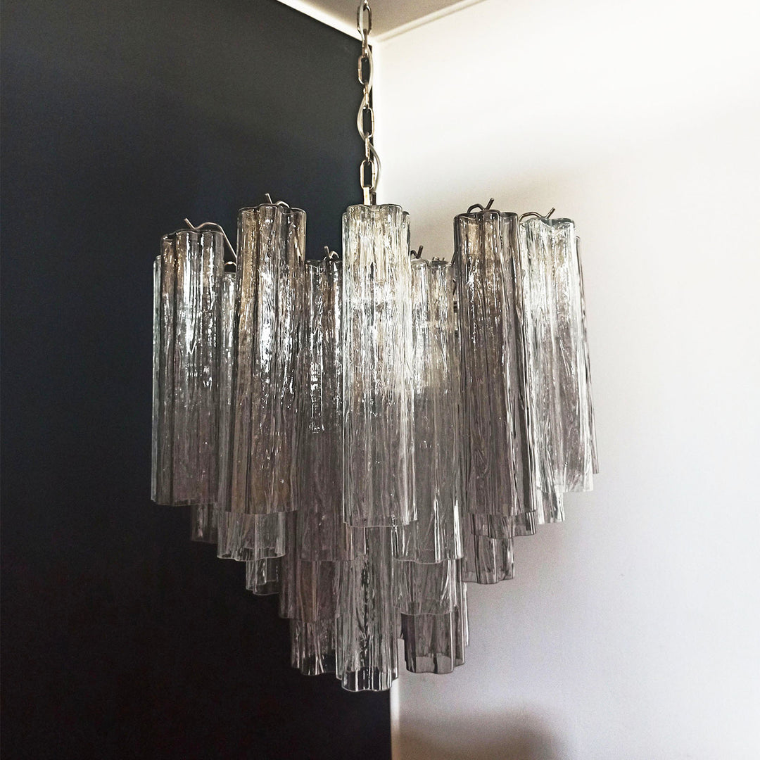 Murano Star Tube Chandelier with smoke gray glass tubes in a dark room corner view
