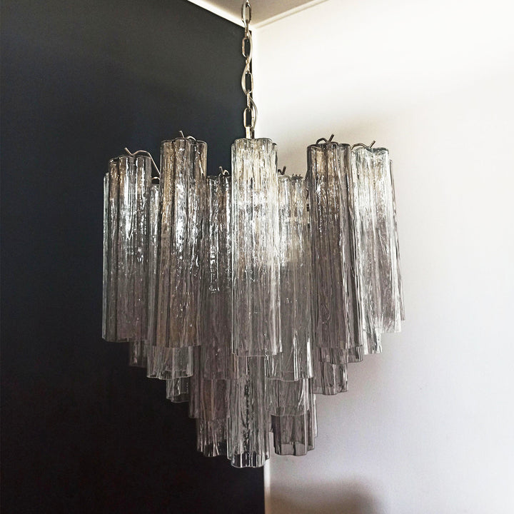 Murano Star Tube Chandelier with smoke gray glass tubes in a dark room corner view