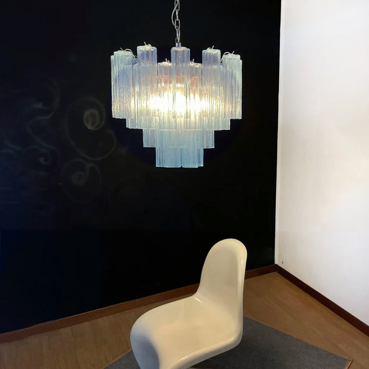 Murano Star Tube Chandelier with turquoise blue glass hanging in a bright room with sheer curtains