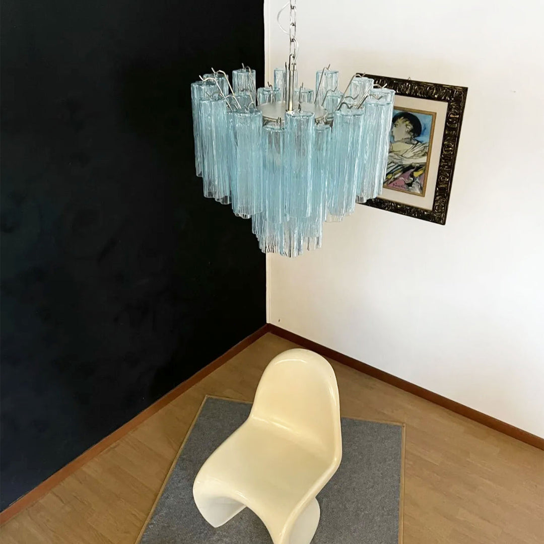 Murano Star Tube Chandelier with turquoise glass in a room with a white modern chair