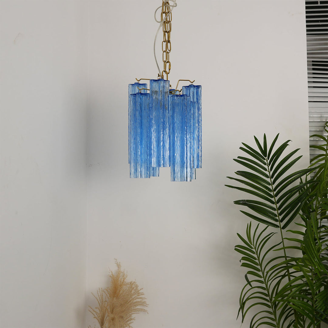 Murano Tubes Glass Chandelier with blue glass hanging in a plain white minimalist room