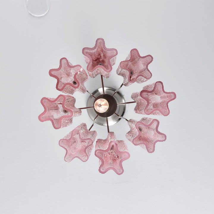 Top view close-up of the pink star-shaped glass tubes on the Murano Chandelier