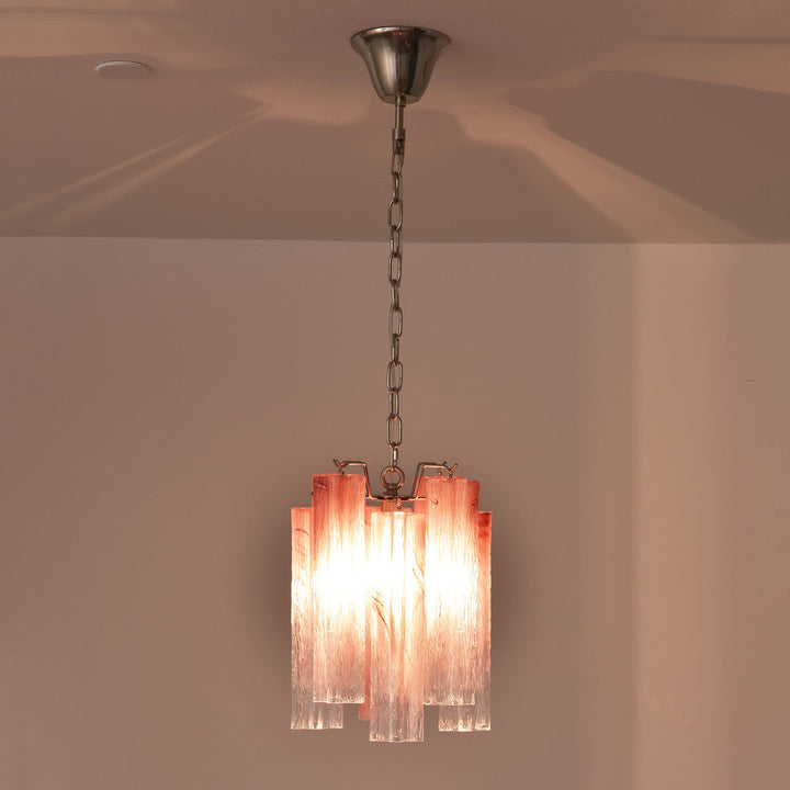 Murano Tubes Glass Chandelier with pink gradient glass hanging from a ceiling with warm light