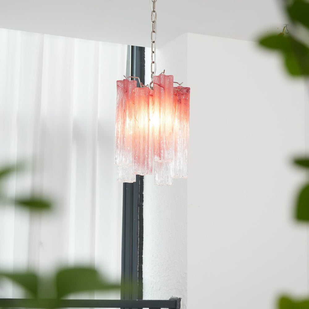 Murano Tubes Glass Chandelier with pink gradient glass hanging near a window with sheer curtains
