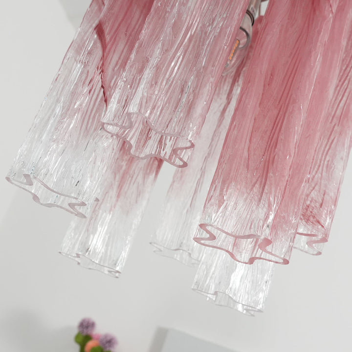 Close-up of the pink gradient glass tubes showing their rippled texture
