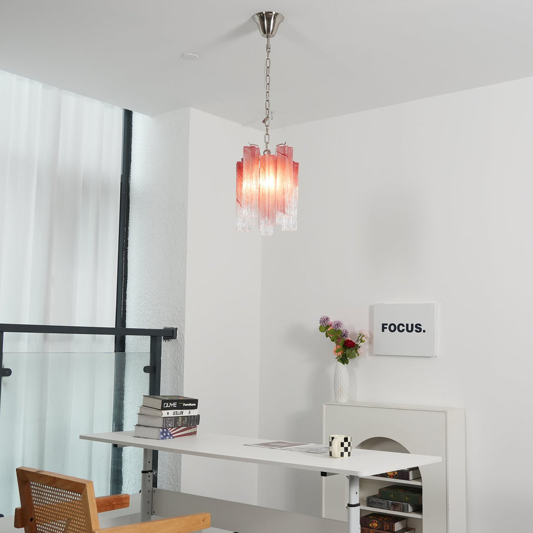 Murano Tubes Glass Chandelier with pink gradient glass hanging above a desk with minimalist decor