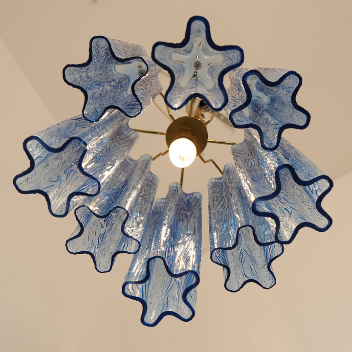 Murano Tubes Glass Chandelier against simple solid color wall background