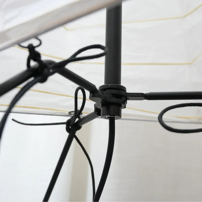 Close-up of the black wire frame structure inside the paper lamp shade