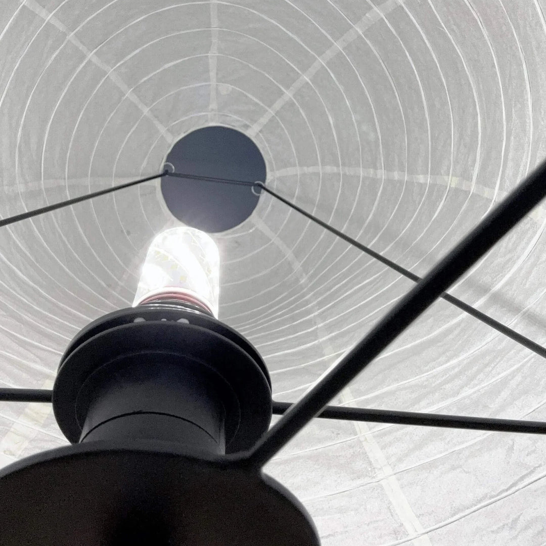 Interior view showing the bulb and socket inside the paper shade