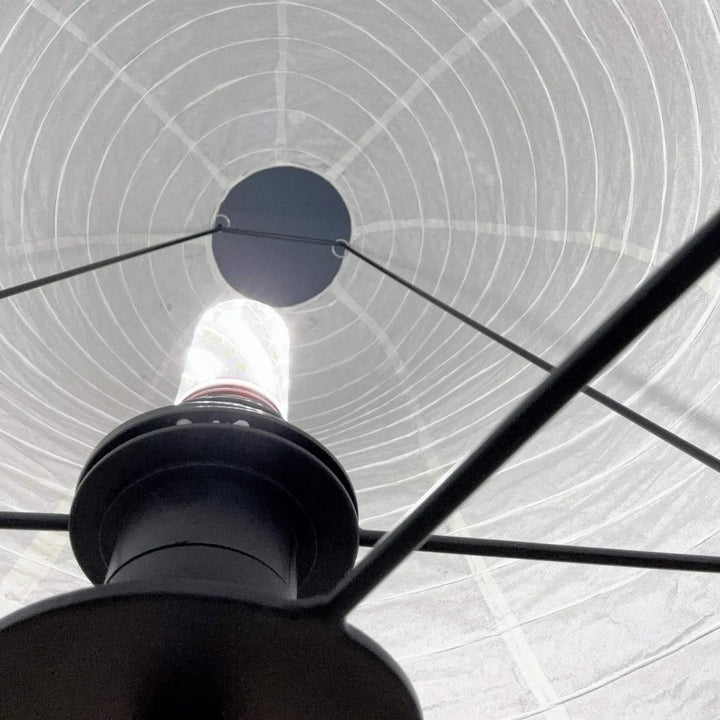 Interior view showing the bulb and socket inside the paper shade