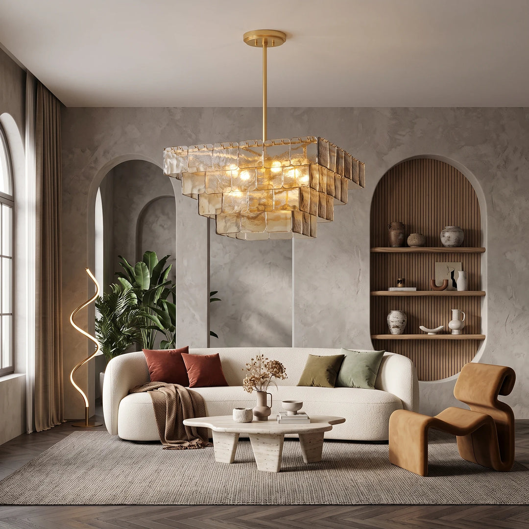Smoked glass chandelier above a curved sofa in a room with arched niches