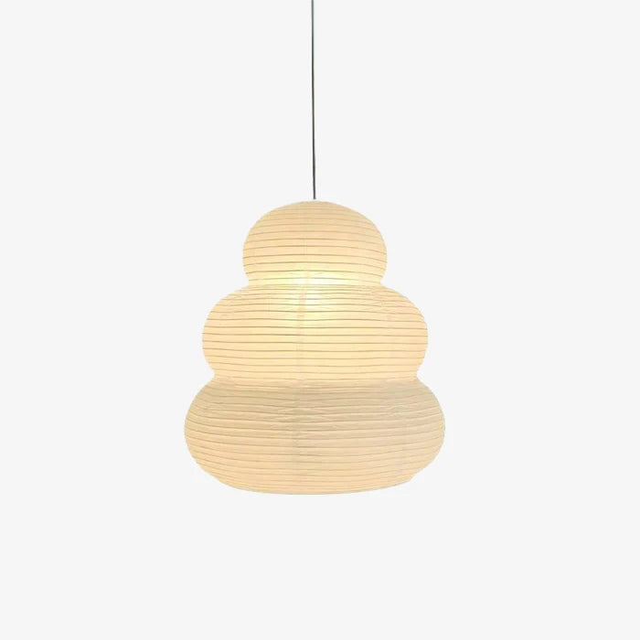Stacked paper lantern pendant shown lit against a pale grey backdrop