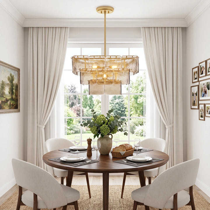 Tiered glass chandelier above a round table set in a bright bay window