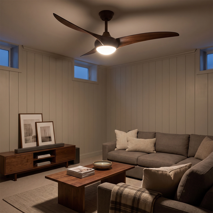 Walnut ceiling fan with light in a wood panelled den with a sofa and low media cabinet