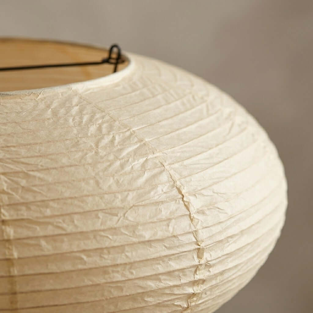 Close-up shot showing natural wrinkled texture and horizontal rib lines of oval washi paper lampshade