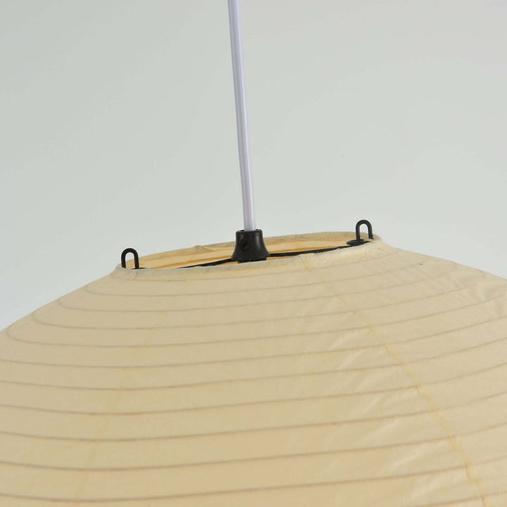 Top partial shot of washi paper pendant with black suspension cord and paper layered texture