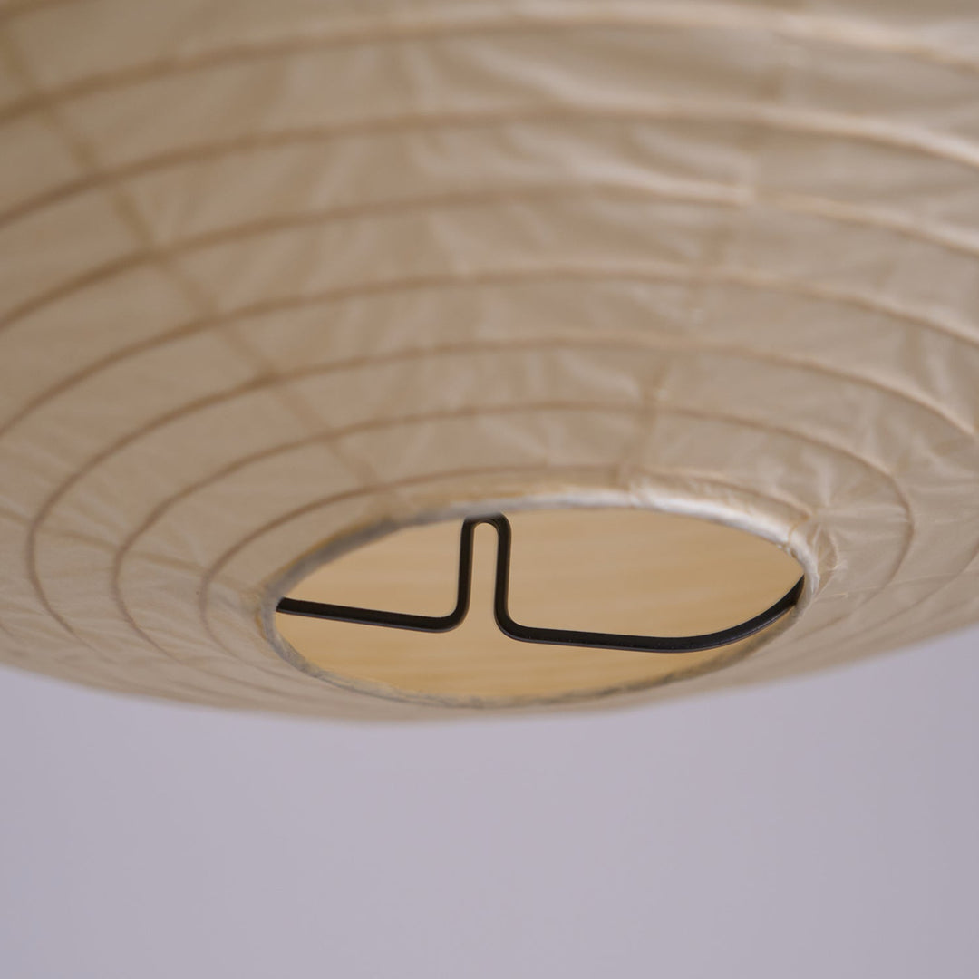 Bottom close-up of washi paper spherical lamp showing internal metal wire support frame structure