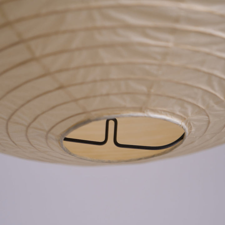 Bottom close-up of washi paper spherical lamp showing internal metal wire support frame structure
