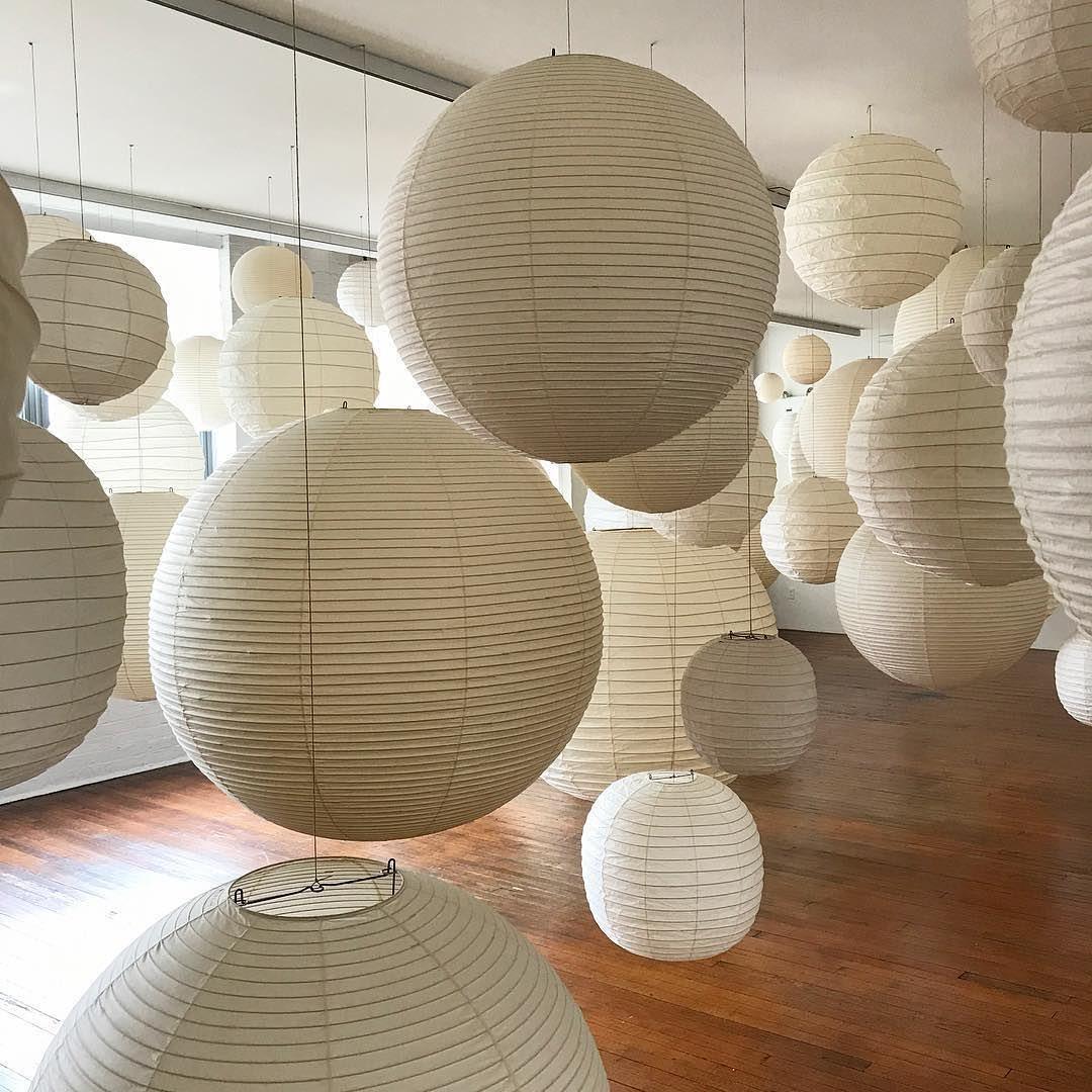 Bottom close-up of washi paper spherical lamp showing internal metal wire support frame structure