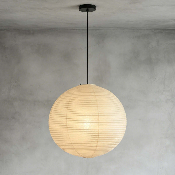 Washi paper sphere pendant with silver metal chain mounted on plain grey ceiling