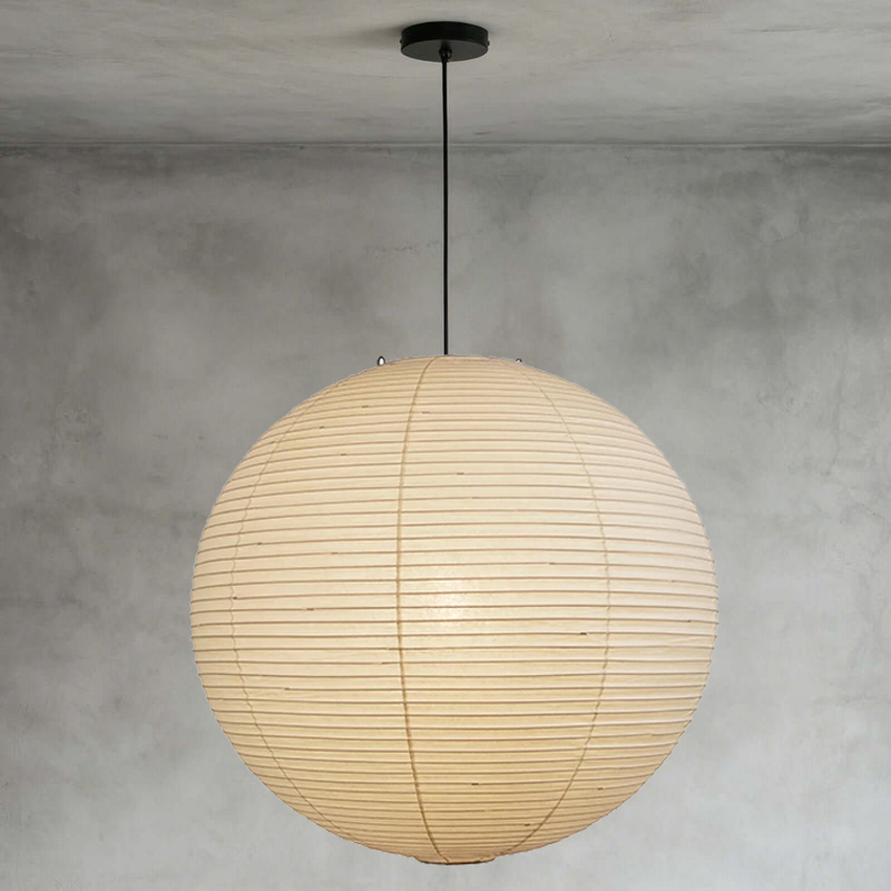 Cozy neutral tone living corner furnished with soft glowing washi paper sphere pendant